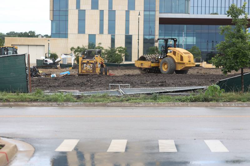 The fence around the site where the old Will County courthouse once was is blown down after a storm blew through Joliet Sunday morning, July 14, 2024.