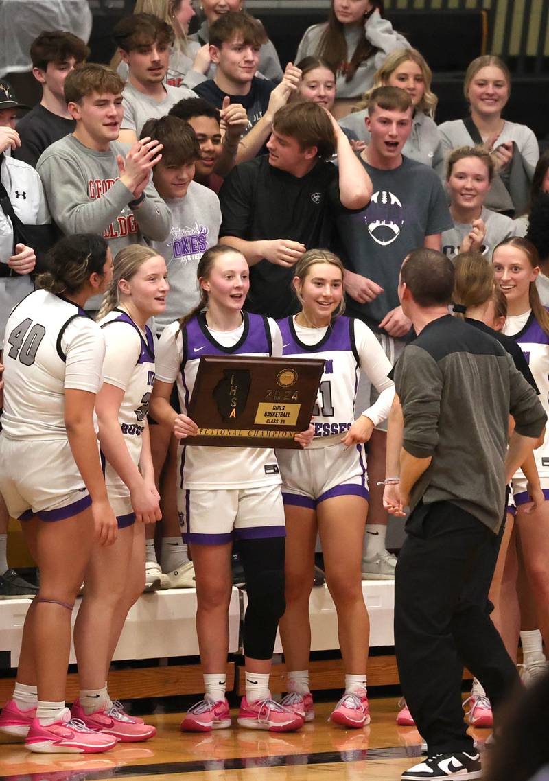 Dixon players and fans celebrate their Class 3A regional championship win over Kaneland Thursday, Feb. 22, 2024, at Sycamore High School.