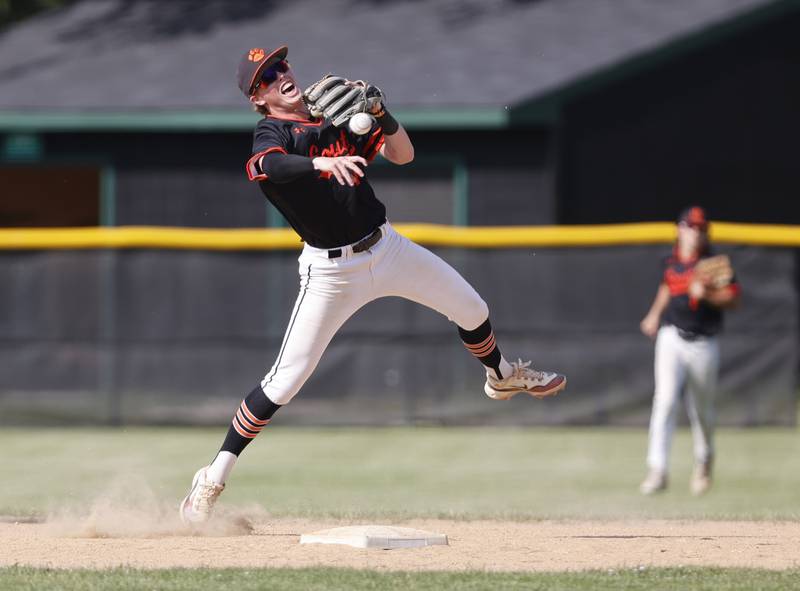 Wheaton Warrenville South's Chris Myers (4) throws to first for an out during the Class 4A York regional semi-final between Wheaton Warrenville South and St. Charles East in Elmhurst on Thursday, May 23, 2024.