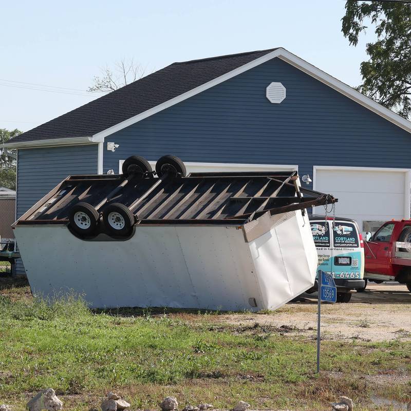 A trailer lies overturned after the storms Monday, July 15, 2024, at Cortland Coach and Camper Storage at the northeast corner of Route 38 and Somonauk Road in Cortland. High Winds and heavy storms hit DeKalb County overnight causing downed trees and power outages in the area.