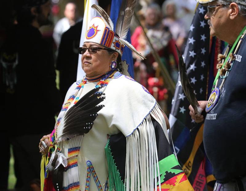 Julie Hill, of Oneida, Wis., an Oneida tribal member, and Bill Brown, founder/coordinator and U.S. Navy veteran, walk in the Grand Entry during the 30th Annual Potawatami Trails Pow-Wow at Shiloh Park on Saturday, August 26th in Zion. 
Photo by Candace H. Johnson for Shaw Local News Network