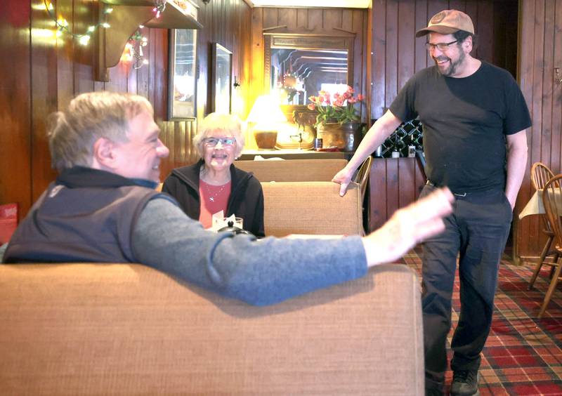 The Hillside Restaurant owner Gavin Wilson (right) talks to regulars Vincent Boone and Vicki Erwin, of DeKalb, Wednesday, Feb. 22, 2023, at eatery in DeKalb. Hillside will soon be closing its doors after 68 years in business.