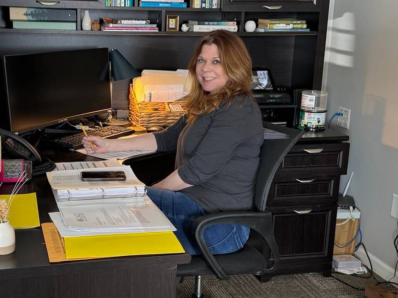 Timberlie Jahn working at her desk at the Grundy County Children's Advocacy Center.