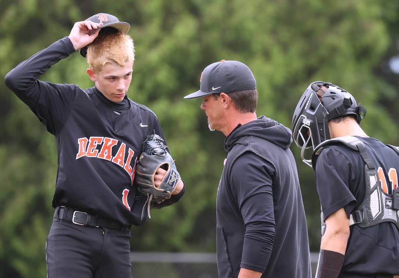 DeKalb head coach Josh Latimer comes to the mound to visit pitcher Jackson Kees during their Class 4A DeKalb Regional championship game against Huntley Friday, May 24, 2024, at Ralph McKinzie Field at Northern Illinois University in DeKalb.