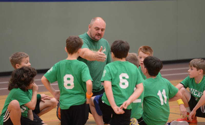 Coach Steve Holstad talks to his team at half time during Youth Basketball held at the LaGrange Park District Saturday, Jan 6, 2024.