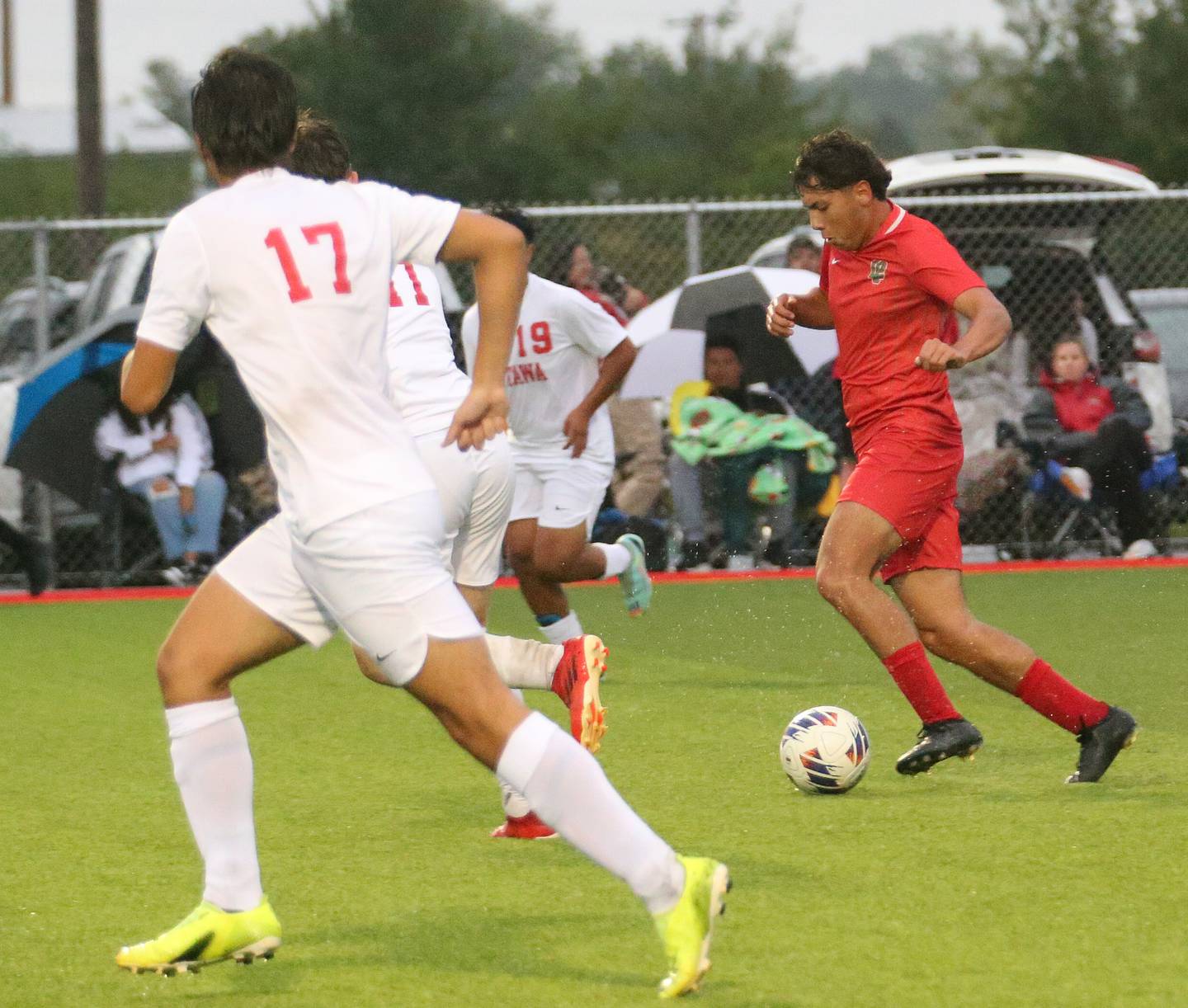 L-P's Giovanni Garcia scores on this drive between Ottawa defenders Alan Sifuentes and teammate Alexzander Houk on Monday, Sept. 11, 2023 at the L-P Athletic Complex in La Salle.