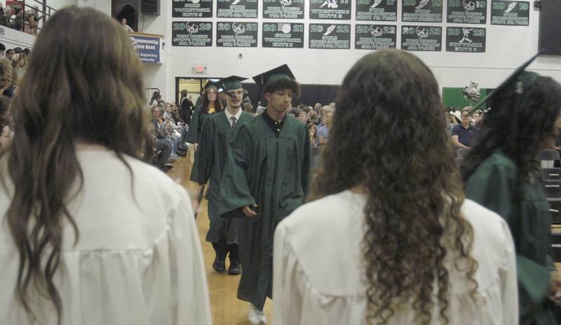 Members of the Rock Falls Class of 2024 make their way to their seats Sunday, May, 26, 2024, during graduation at Tabor Gym at Rock Falls High School.