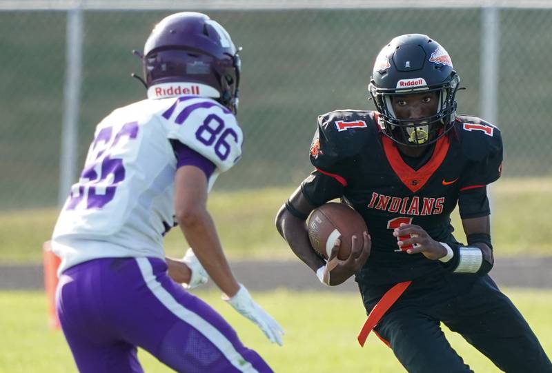 Sandwich Simeion Harris (1) carries the ball against Manteno during a football game at Sandwich High School on Saturday, Aug 26, 2023.