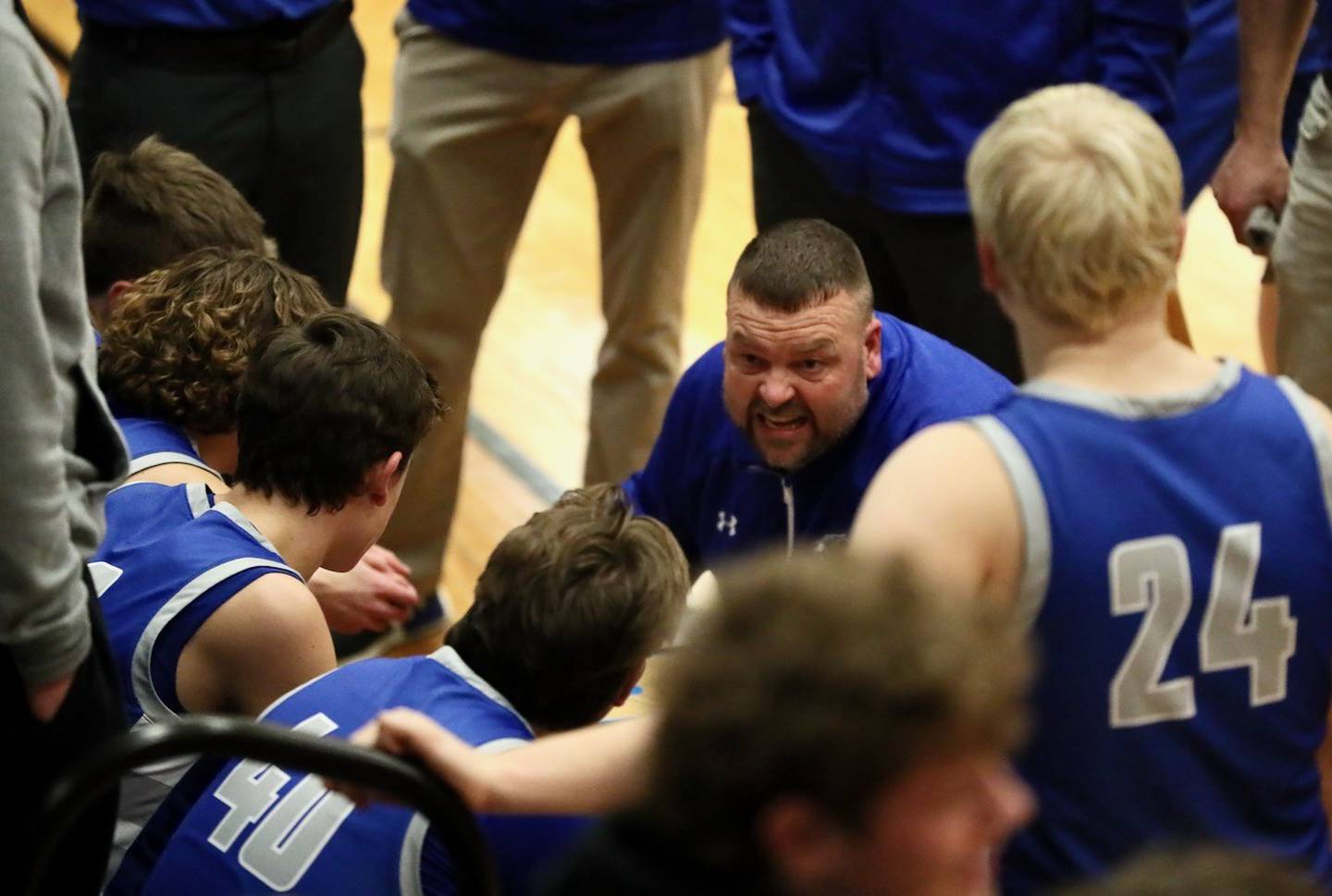 Princeton coach Jason Smith works his team during a timeout Tuesday night at Kewanee. The Tigers lost 64-59 win in overtime.