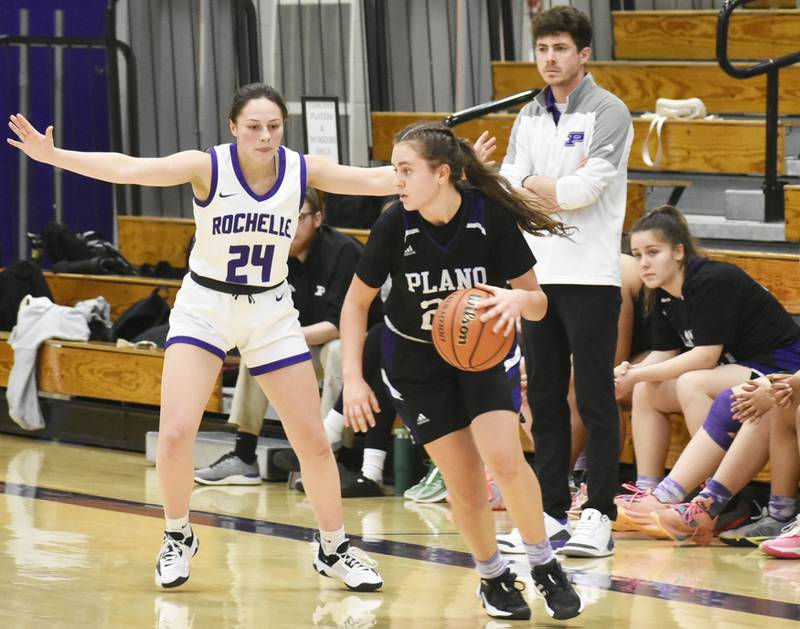 Plano’s Josie Larson looks to drive around Rochelle’s Sydney Tabor during a Class 3A Rochelle Regional quarterfinal, Saturday, Feb. 10, 2024.