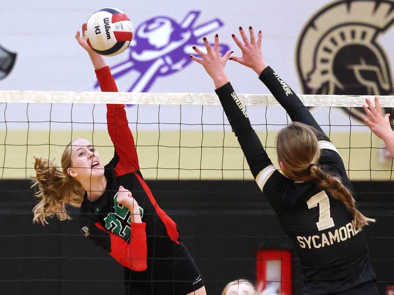 Sycamore's Laci Neece tries to tip the ball by LaSalle-Peru's Katie Sowers (left) and Ava Currie during their match Tuesday, Oct. 10, 2023, at Sycamore High School.