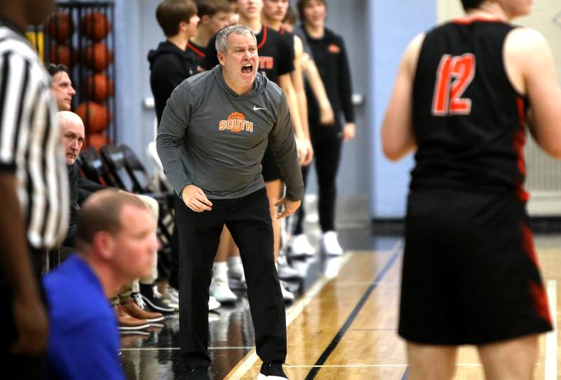 Wheaton Warrenville South Head Coach Michael Healy yells to his team during a Class 4A Willowbrook Regional semifinal game against Geneva on Wednesday, Feb. 21, 2024.