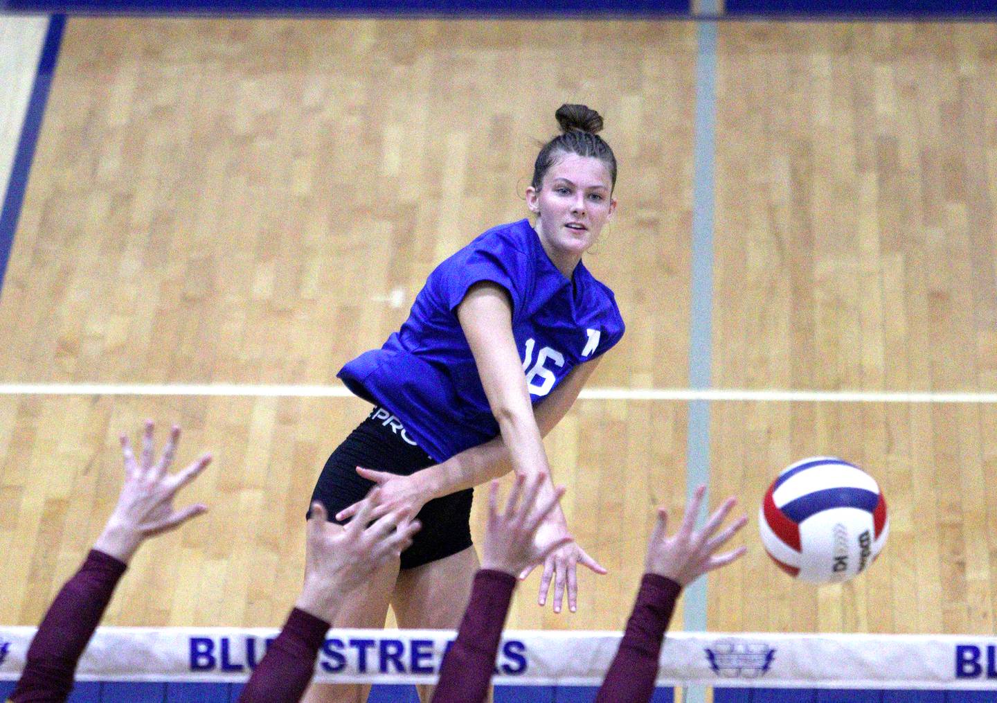 Woodstock’s Hallie Steponaitis sends the ball over the net against Richmond-Burton in varsity volleyball at Woodstock Monday night.