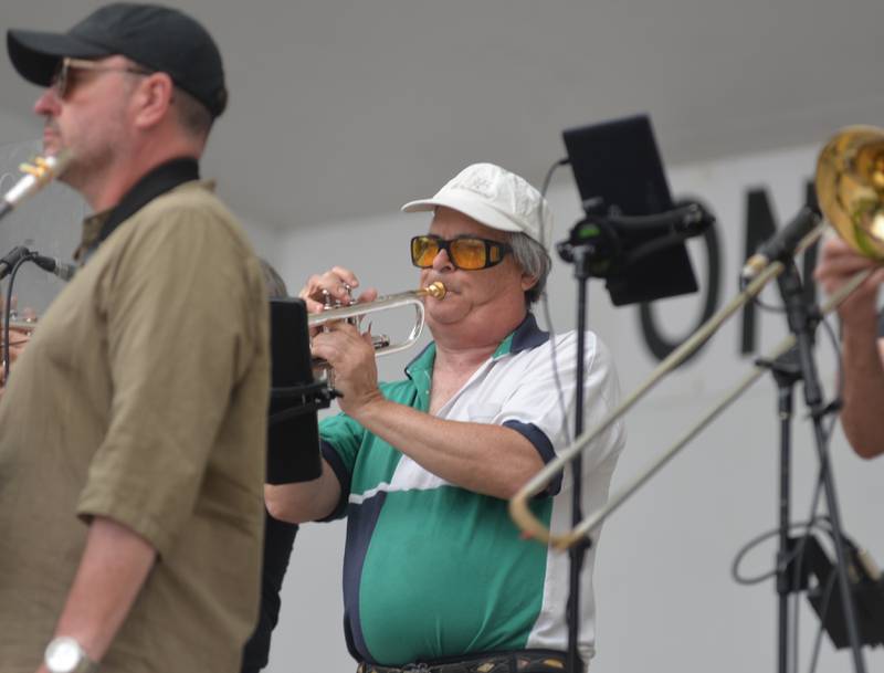 Terry Connell of Mt. Morris plays the trumpet with Brass from the Past at the opening night of the Jamboree music series in downtown Mt. Morris on Friday, June 7, 2024. The free concert series continues through the summer each Friday night on the campus.