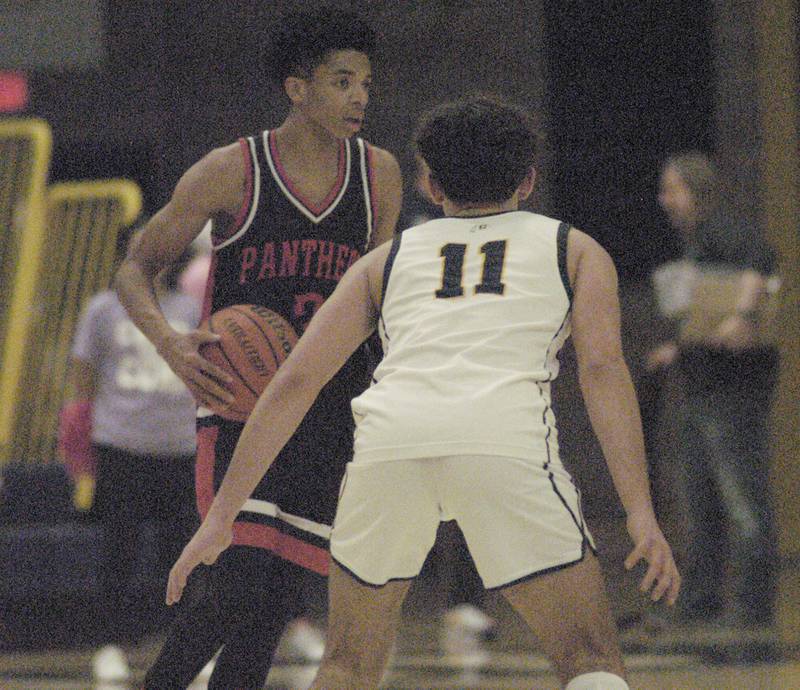 Sterling  player Nico Battaglia  defends against a United Township player during their game Friday, Feb. 9, 2024 at Sterling High School