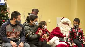 A little drizzle can’t keep Santa Claus from lighting Montgomery’s Christmas tree