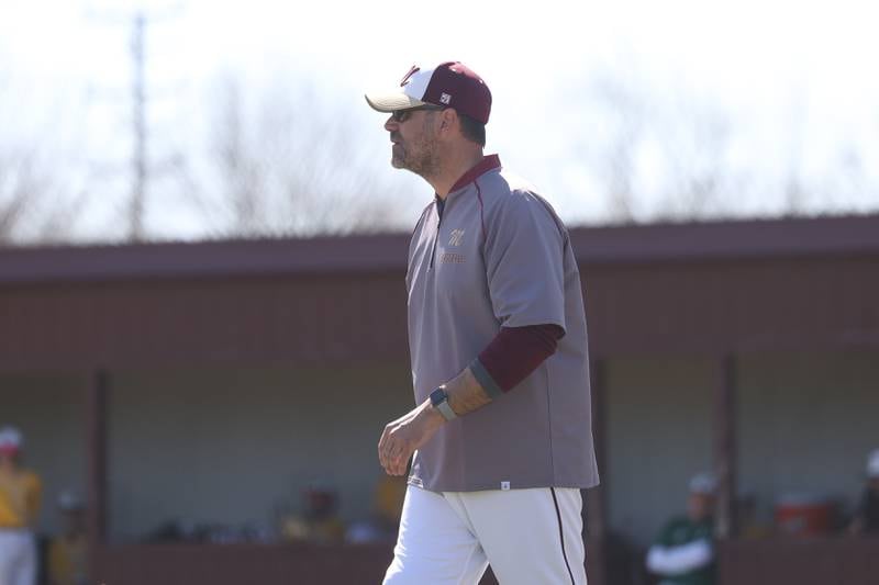 Morris head coach Todd Kein heads to third base against Coal City on Saturday, April 13, 2024