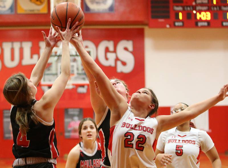 Henry-Senachwine's Mikayla Frawley (left) and Streator's Charlee Bourell (right) grab a rebound at the same time on Wednesday, Jan,. 4, 2023 at Streator High School.