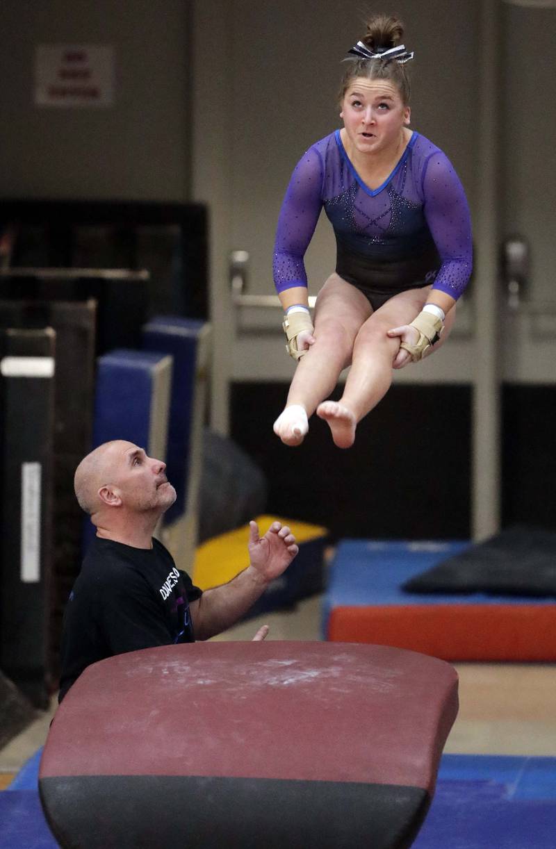 Downers Grove South's Emily Smetana competes in the vault during the IHSA Girls Gymnastics State Final meet Friday February 18, 2022 at Palatine High School.