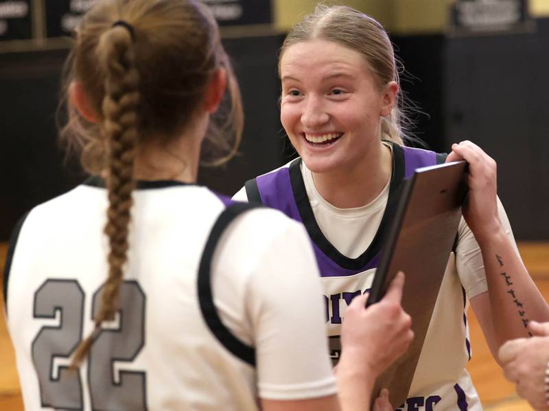 Dixon’s Katie Drew (left) and Jessie Pitman receive their Class 3A regional championship plaque after their win over Kaneland Thursday, Feb. 22, 2024, at Sycamore High School. Dixon (27-6) will face Lincoln (35-0), the East Peoria Sectional winner, at 7 p.m. Monday, Feb. 26, in the La Salle-Peru Supersectional for a trip to state.