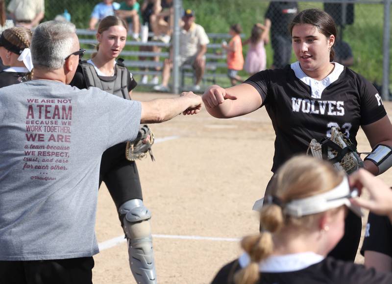 Prairie Ridge's Reese Mosolino is congratulated after pitching a scoreless inning during their Class 3A sectional final against Sycamore Friday, May 31, 2024, at Sycamore High School.