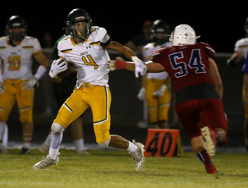 Crystal Lake South's Anthony Demirov gets out of the tackle attempt of Dundee-Crown's Teigen Moreno during a Fox Valley Conference football game on Friday, Aug 30, 2024, at Dundee-Crown High School in Carpentersville.