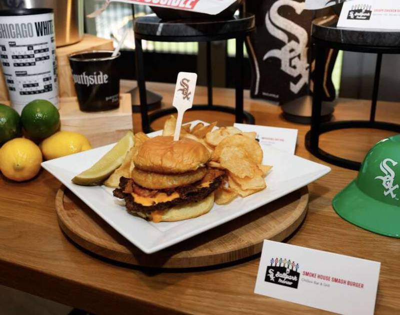 One of the new food offerings at Guaranteed Rate Field will be the smoke house smash burger, with pulled pork, BBQ sauce, beer cheese sauce and an onion ring, at the ChiSox Bar & Grill.