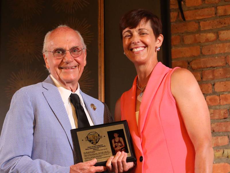 Amy (Johnson) DeVerteulil poses with emcee Lanny Slevin during the Illinois Valley Sports Hall of Fame awards banquet on Thursday, June 6, 2024 at the Auditorium Ballroom in La Salle.