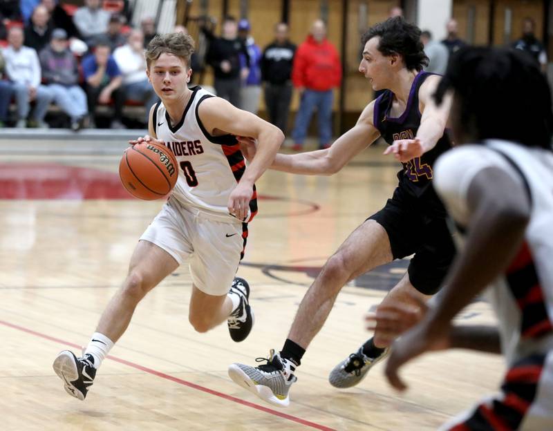 Bolingbrook’s Trey Brost drives toward the basket during the Class 4A East Aurora Boys Basketball Sectional final against Downers Grove North on Friday, March 1, 2024.