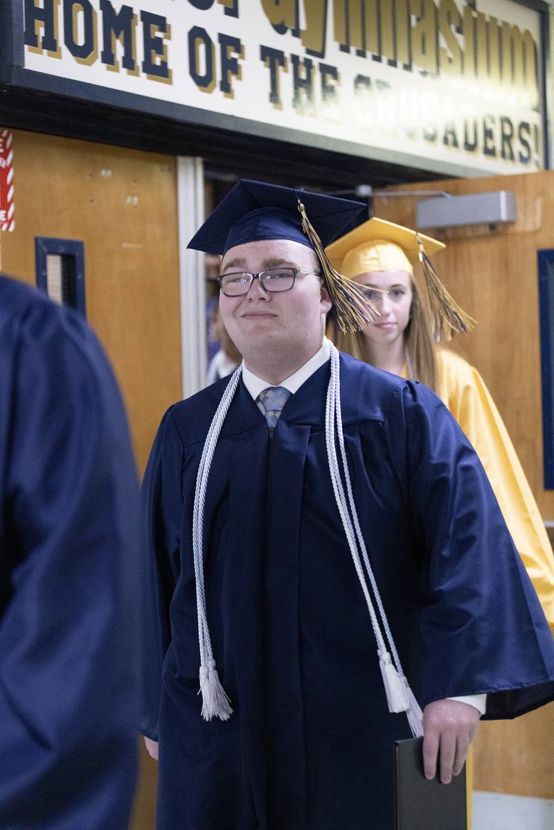 Dalton Ryan walks out Sunday, May 26, 2024, of Bader Gymnasium following Marquette Academy High School's commencement ceremony.