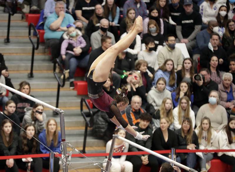 Prairie Ridge’s Gabriella Riley competes on the uneven parallel bars during the IHSA Girls Gymnastics State Final meet Friday February 18, 2022 at Palatine High School.