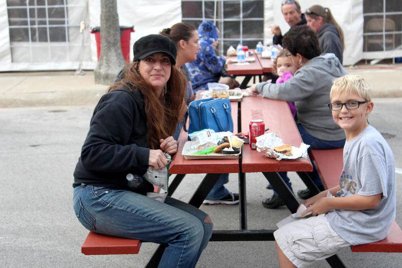 Mary Eliopoulos (left) and Aiden Eliopoulos (right), 9, enjoy dinner at the Taste of Sandwich along Railroad Street on Wednesday, Sept. 27. While some food was saved for school treats, the two sampled a variety of items from the local businesses and community leaders who participated.