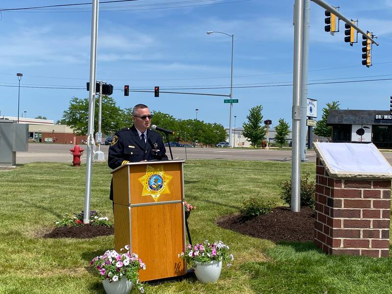DeKalb County Sheriff Andy Sullivan gives remarks about his late Deputy Christina Musil at the new first responders memorial outside Isaac Executive Suites, 2675 Sycamore Road, DeKalb, during a dedication ceremony held Sunday, May 19, 2024. The memorial was unveiled at the close of National Police Week.
