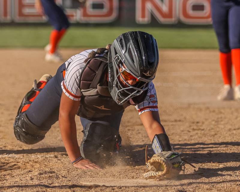 Oswego's Kiyah Chavez (10) tags the plate for a force out to end the inning with the bases loaded during Class 4A Plainfield North Sectional semifinal softball game between Wheaton-Warrenville South at Oswego. May 29th, 2024.