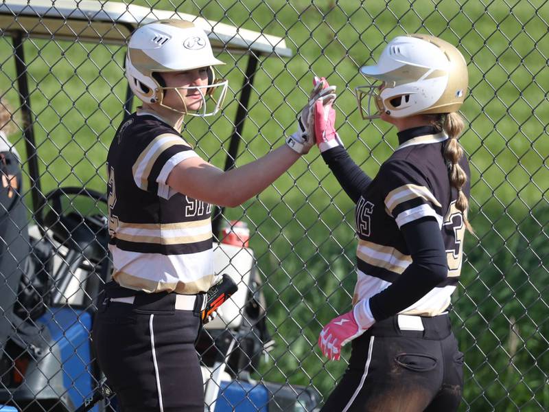 Sycamore's Faith Heil (right) gets congratulated after scoring by Ema Durst during their game against Sterling Tuesday, May 14, 2024, at Sycamore High School.