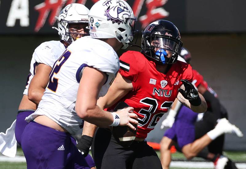 Northern Illinois' Quinn Urwiler pressures Western Illinois' Nathan Lamb during their game Saturday, Aug. 31, 2024, in Huskie Stadium at NIU in DeKalb.