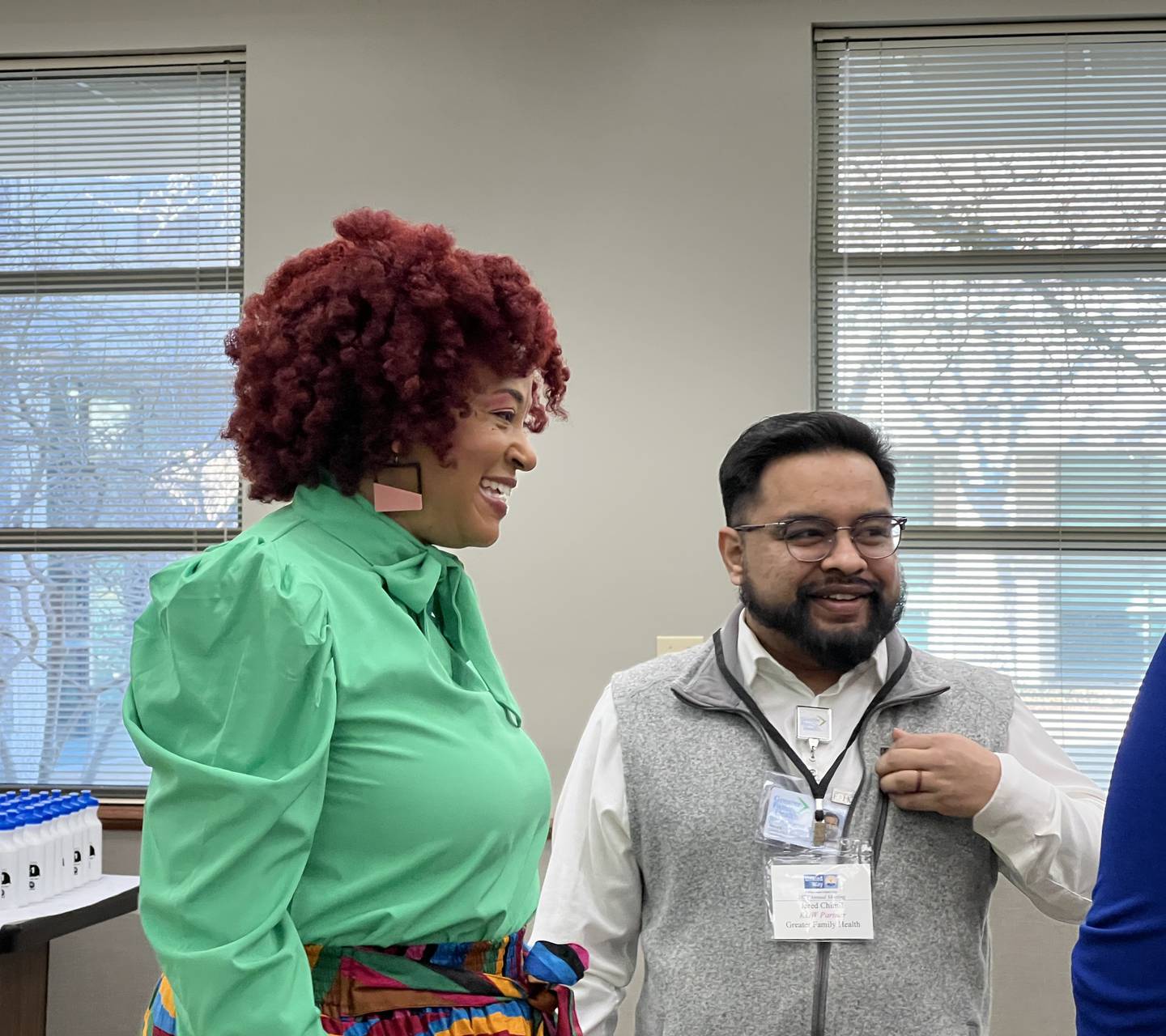 Michele Vaughn, executive director of Kishwaukee United Way, talks with Jared Chimil, from Greater Family Health in DeKalb, before the start of the 2024 Kishwaukee United Way annual meeting on Feb. 27, 2024.