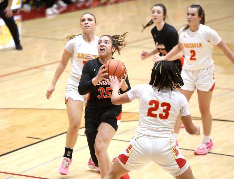St. Charles East’s Corinne Reed attempts a shot during a Class 4A Batavia Sectional semifinal game against Batavia on Tuesday, Feb. 20, 2024.