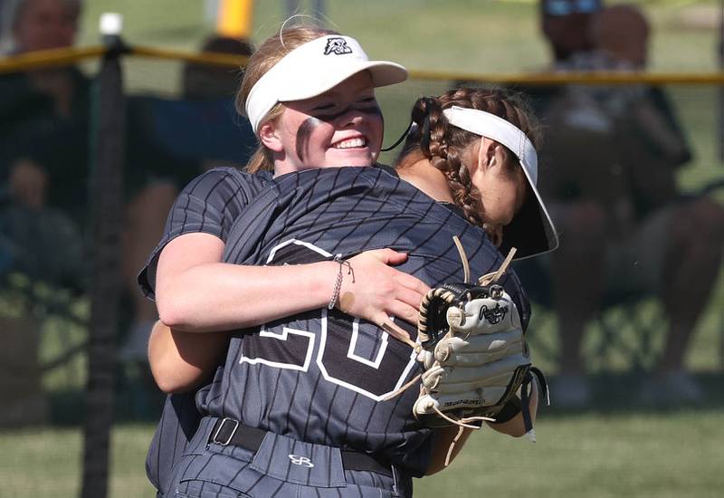 Kaneland's Lexi  Workman (front) celebrates after making a diving catch in left field with Isabelle  Stombres during their Class 3A sectional semifinal against Sycamore Thursday, May 30, 2024, at Sycamore High School.