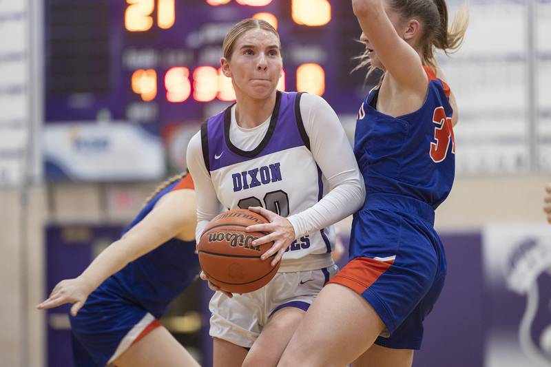 Dixon’s Nora Fordham works against Eastland’s Trixie Carroll Wednesday, Jan. 24, 2024 at Dixon High School.