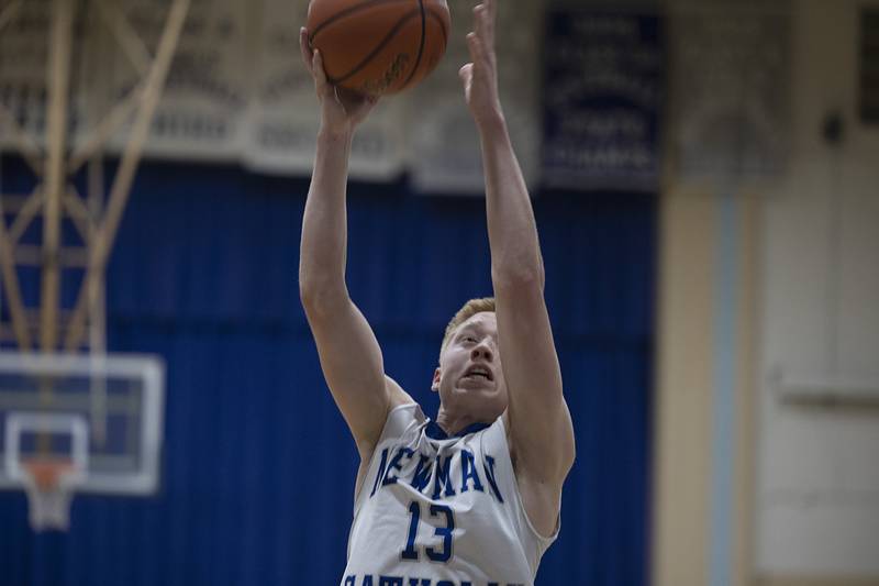 Newman’s George Jungerman pulls in a rebound against AFC Monday, Feb. 19, 2024 in a regional quarterfinal game at Newman High School.