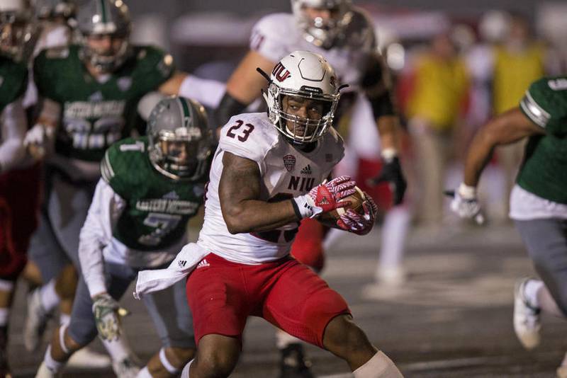 Northern Illinois junior running back Jordan Huff rushes against Eastern Michigan.