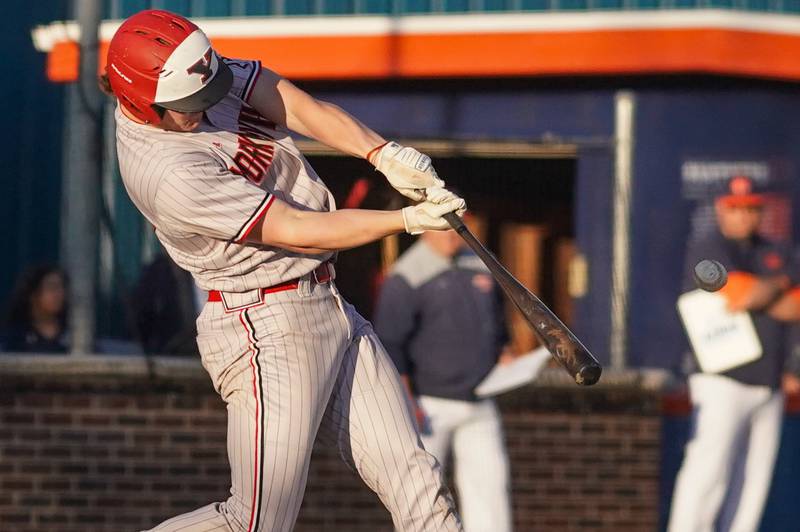 Yorkville's Nate Harris (15) hits a grand slam against Oswego during a baseball game at Oswego High School on Monday, April 29, 2024.