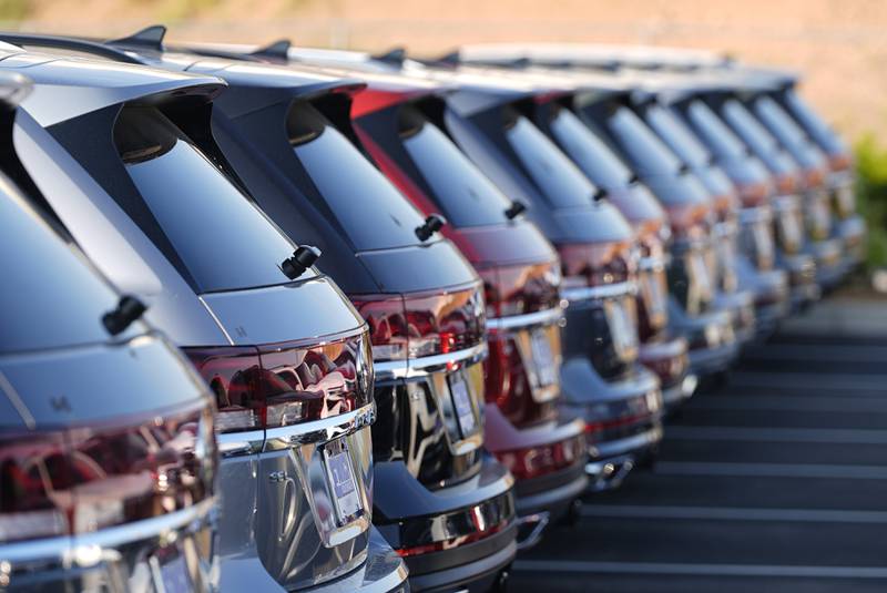 A long row of unsold 2024 Atlas utility vehicles is shown Sunday, July 28, 2024, at a Volkswagen dealership in Denver. (AP Photo/David Zalubowski)