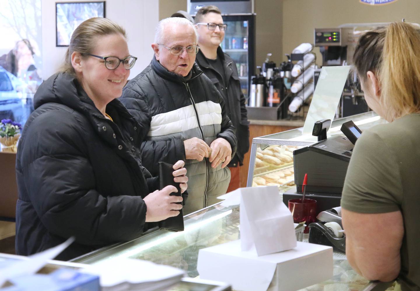 Customers line up at Elleson's Bakery in Sycamore Tuesday, Feb. 21, 2023, to place their orders for paczki. Elleson’s is always full of customers on Fat Tuesday, also known as Paczki Day, due to the tradition of enjoying the fried Polish dessert.