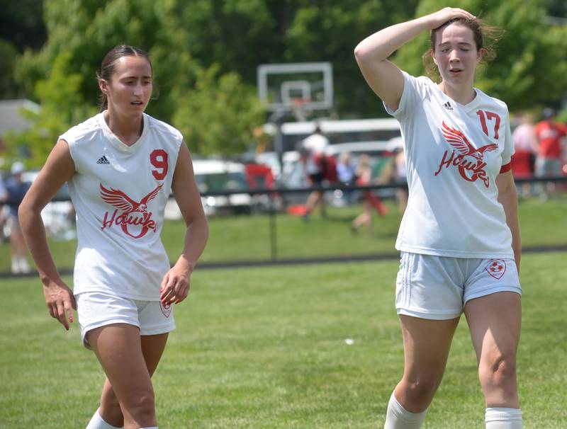 Oregon seniors Kenna Wubben (9) and Teagan Champley (17) react after losing 2-1 to Stillman Valley at the 1A Indian Creek Sectional on Saturday, May 18, 2024. The Hawks ended the season with a 18-2 record.