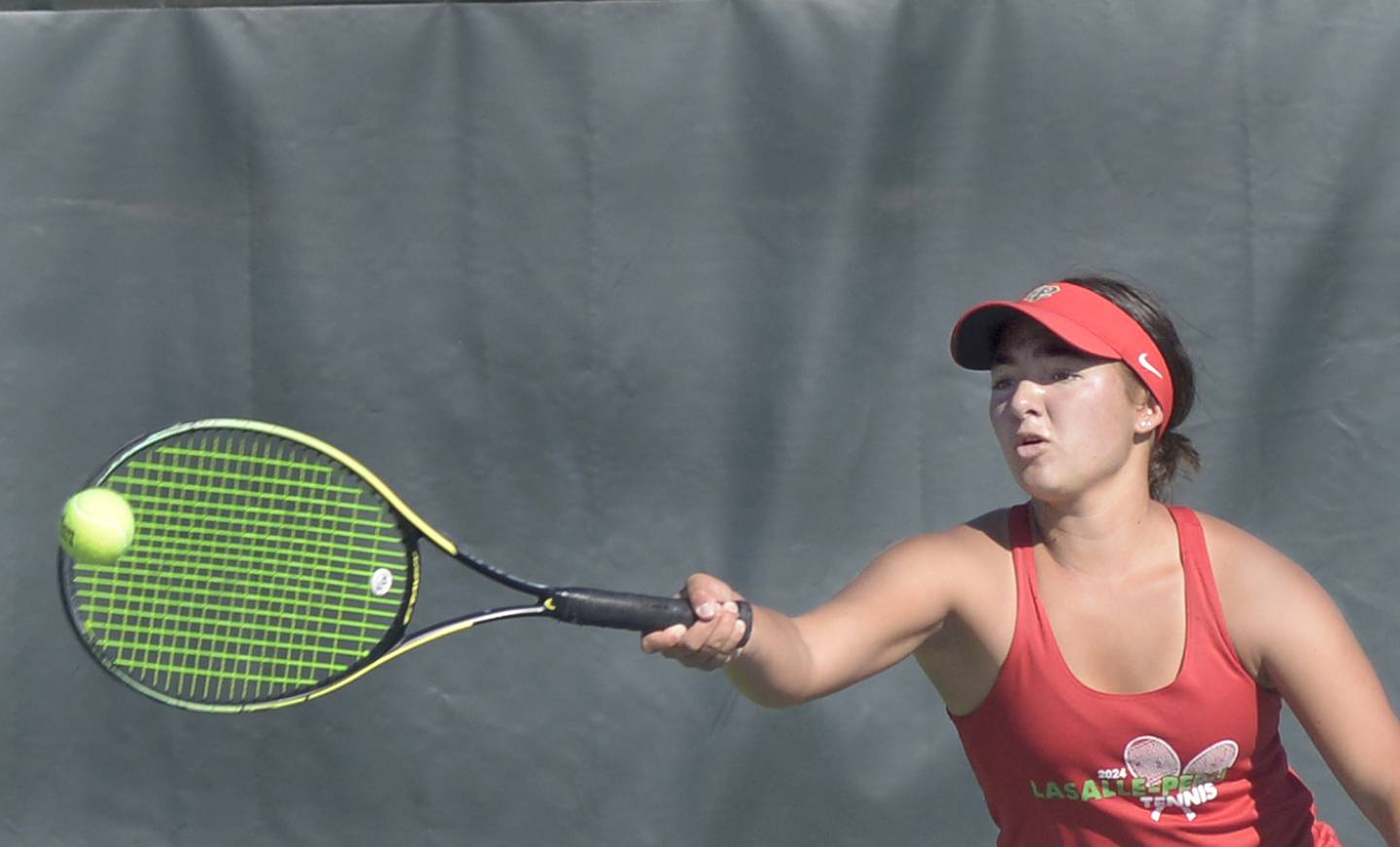 La Salle Peru junior Grace Pecchio hits a shot during the singles third-place match of Saturday's Class 1A Ottawa Sectional at the Henderson-Guenther Tennis Facility.