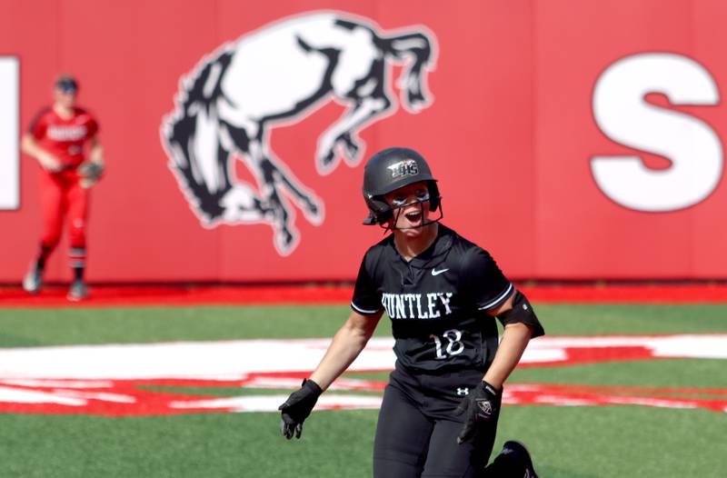 Huntley’s Meghan Ryan rounds the bases on her home run against Barrington in sectional final softball  action at Barrington Friday.