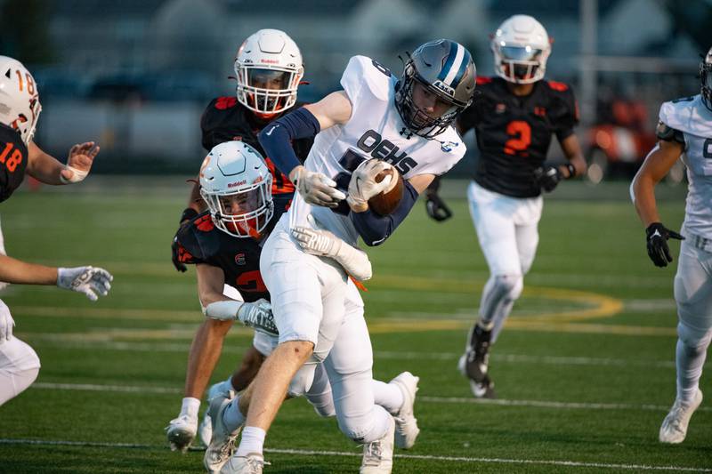 Plainfield East's Ben Haupt brings down Oswego East's Andy Pohlman during a game on Thursday Sept. 12, 2024 at Plainfield East High School