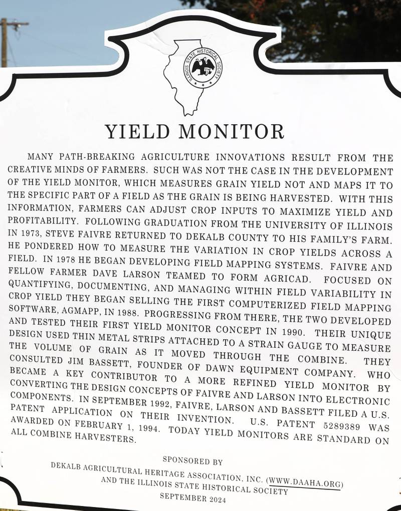 The new historical marker Tuesday, Sept. 10, 2024, during the dedication, hosted by the DeKalb Area Agricultural Heritage Association, at the Faivre farm in DeKalb. The marker celebrates the creation yield monitor, an important innovation in farming.